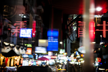 Fototapeta na wymiar Blurred street market lights at night time
