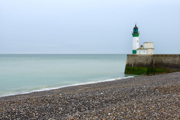 Fototapeta na wymiar Lighthouse at the entrance to le Treport Harbour