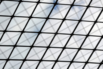 Architectural background. Glass ceiling of metal frame and planar glazing. Look up.