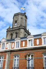 Fototapeta na wymiar The townhouse of Boulogne-sur-mer over blue sky.