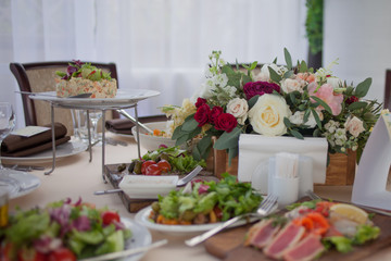 Wedding decor. Flowers in the restaurant, food on the table