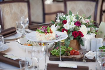 Wedding decor. Flowers in the restaurant, food on the table