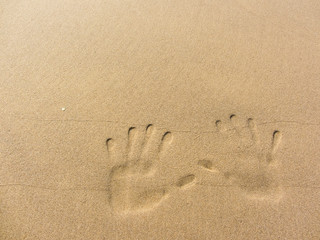 playing with sand long the shoreline