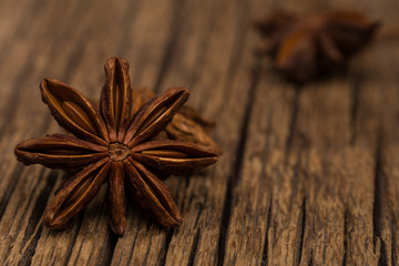 Star anise on old wooden table.