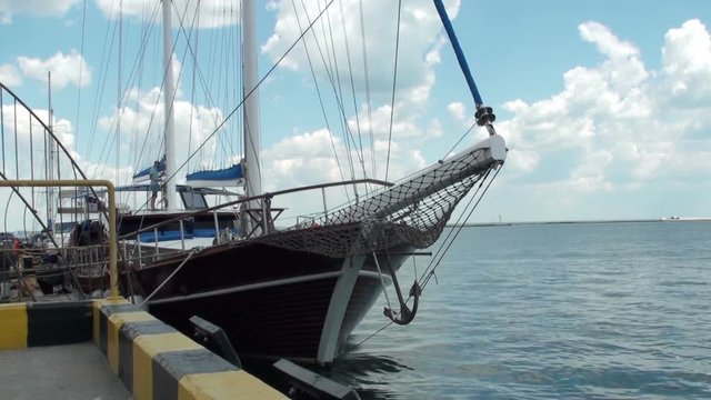 Sailing yacht is at the pier in the port. HD 1920x1080 Video Clip