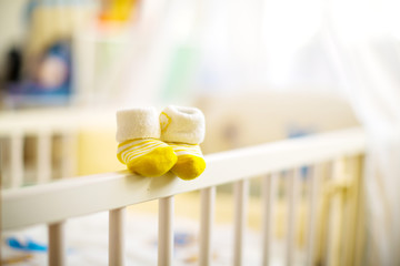 Children  shoes in a cot