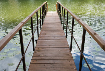 Fototapeta premium wooden gangway on the lake