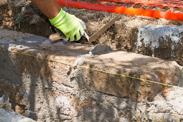 bricklayer making a new wall