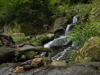 Naklejka na ściany i meble beautiful waterfall in the forest
