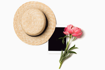 Tablet mockup with empty screen, straw hat and pink peony flower on simple background. 