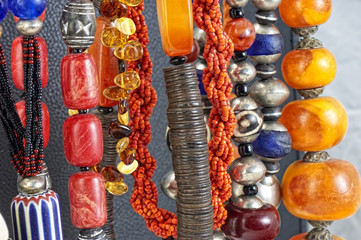 Fototapeta premium Colorful natural stone necklaces, jewelry background