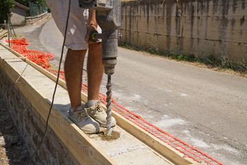 bricklayer building a new wall in a site