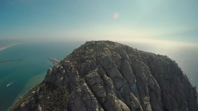 Aerial Drone high orbiting view of Morro Rock in Morro Bay, California.