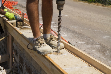 bricklayer building a new wall in a site
