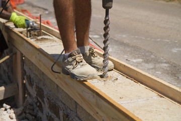 bricklayer building a new wall in a site