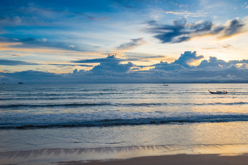 Orange roll and blue heavy clouds over the sea in the tropics