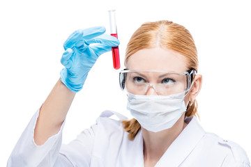 A chemist with a substance in a test tube makes an analysis