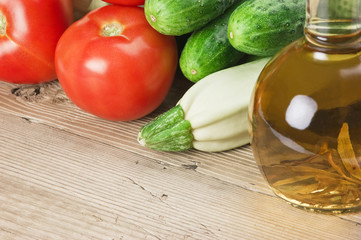 vegetables and a bottle of oil, still life