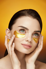 Eye Skin Care Patches. Beautiful Smiling Girl With Mask On Face