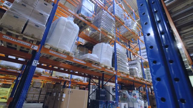 Racks and shelves in a warehouse. Warehousing concept. 4K.