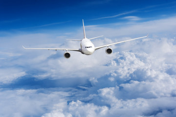 aeroplane flying above clouds. Passenger Airliner flying