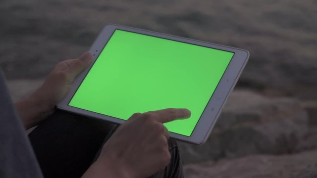 Woman Using Smart Tablet Outdoors