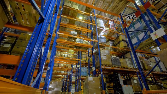 Big indutrial warehouse interior. Storage facility with no people. 4K.