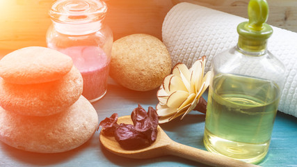 Aromatic candle and spa stones and massage oil and towel concept spa treatments