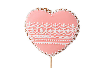 Topper of a gingerbread with glaze in the form of heart with a beautiful pattern for a Valentine`s day. Isolated.