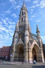 Fototapeta na wymiar The magnificent spire of the Sacre Coeur de Lille