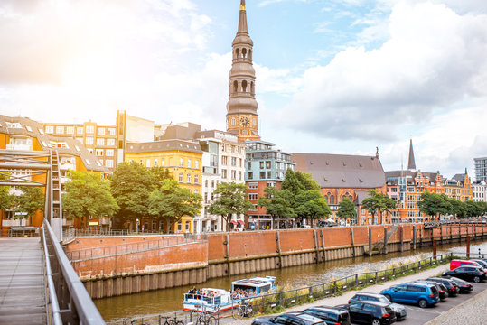 Riverside view on the old town with saint Catherine church During the sunset in Hamburg city, Germany
