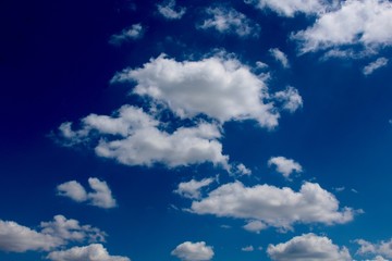 Naklejka na ściany i meble The white clouds in the blue sky.