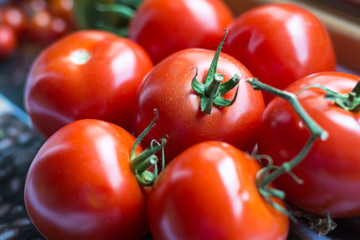 A couple of tomatoes in the kitchen