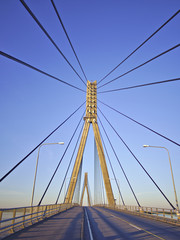 Pylons and cables of cable-stayed bridge. Architectural background.