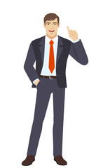 Fototapeta premium Businessman with hand in pocket pointing up