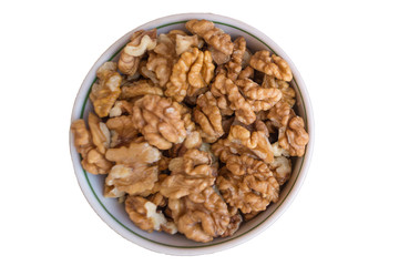 White ceramic bowl with walnuts isolated on white background