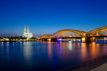Image of Cologne with Cologne Cathedral and Rhine river during sunset in Cologne, Germany.