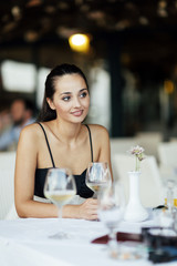 Beautiful woman sitting in restaurant