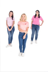 Obraz premium women in pink t-shirts with ribbons