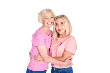 women in pink t-shirts hugging