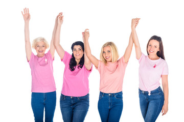 women in pink t-shirts holding hands