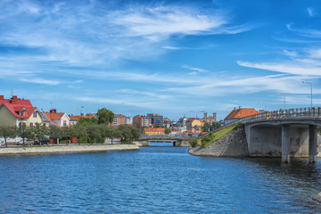 KARLSKRONA, SWEDEN - 2017 July. Typical red Swedish wooden houses with natiaonal flag in the city of Karlskrona
