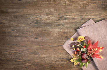 Oak wooden background with Autumn decorations, space