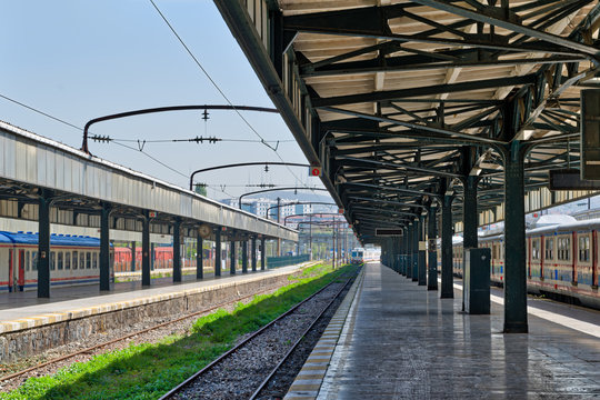 Interior shot of Haydarpasha Railway Terminal featuring metal truss and two colored stopped trains, Kadikoy, Istanbul, Turkey, built 1909 and closed in 2013 due to the rehabilitation of Marmaray line