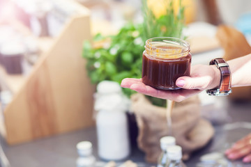 A person taste honey.