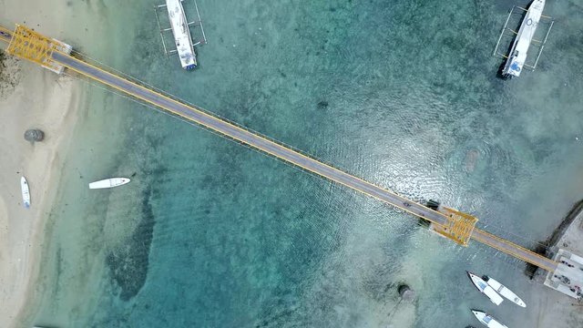 Bird's Eye View of the Yellow Bridge Connecting the Islands of Nusa Ceningan and Lembongan in Bali