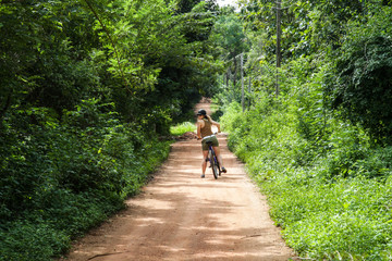 Girl on a bike in Sri Lanka