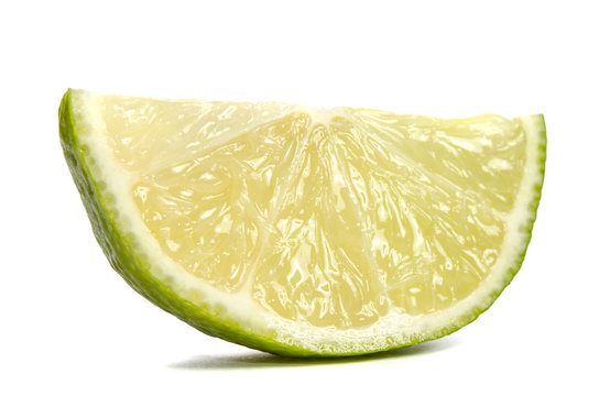 slice of  juicy lime isolated on white background