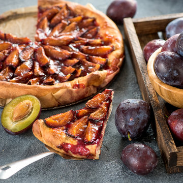 Homemade plum pie, autumn healthy vegetarian dessert, square image