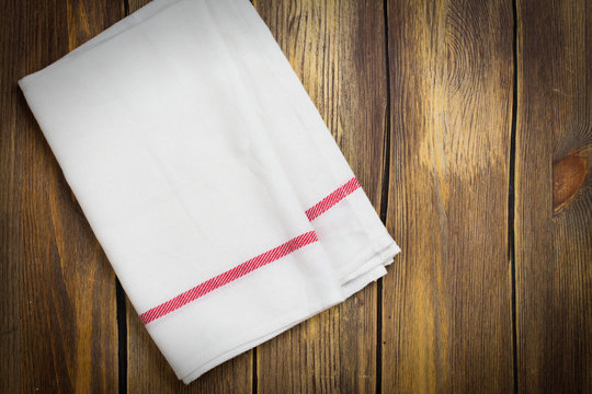 Linen Kitchen Towel On White Table. Space For Text